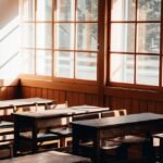 Boho classroom decor with wooden desks and warm natural light