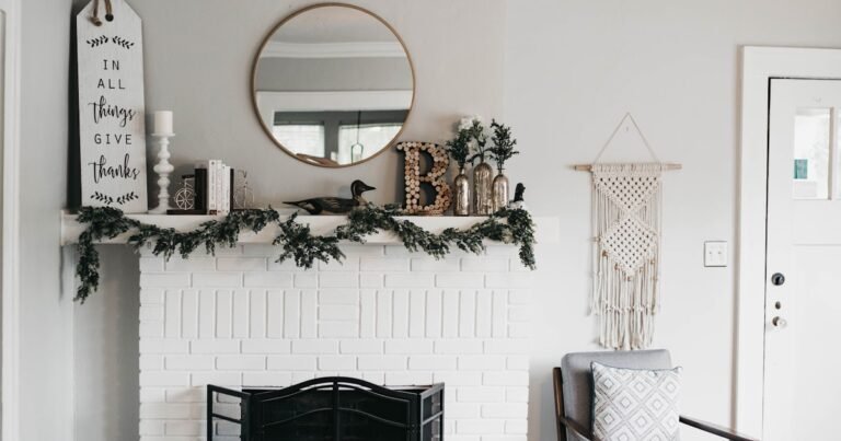 Fall mantel decorating ideas on a white fireplace mantel with layered decor and warm accents