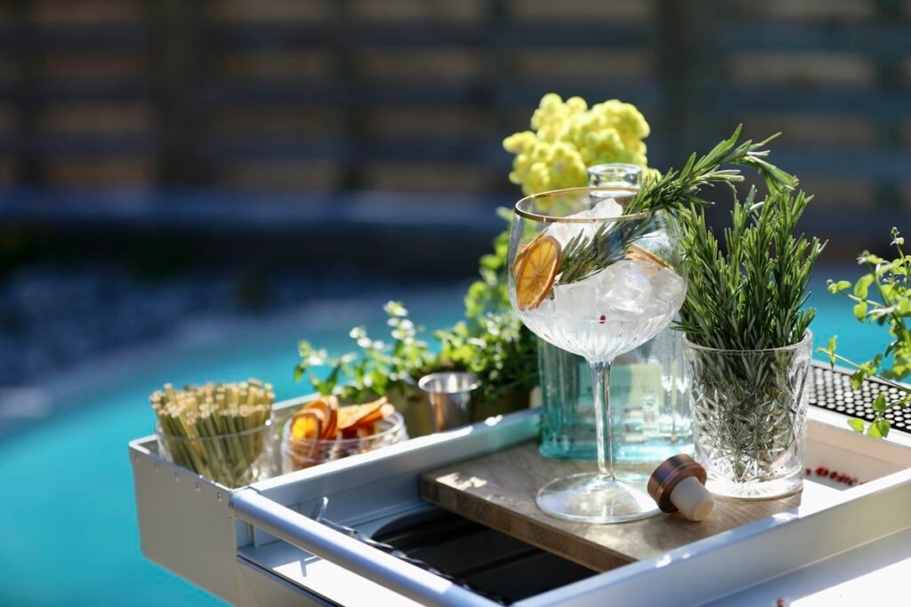 Tray holding a glass of water and small plants