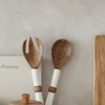 Kitchen counter decor with a cutting board and styled utensils
