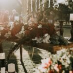 Wedding decor checklist essentials with floral centerpieces and candle holders on a reception table