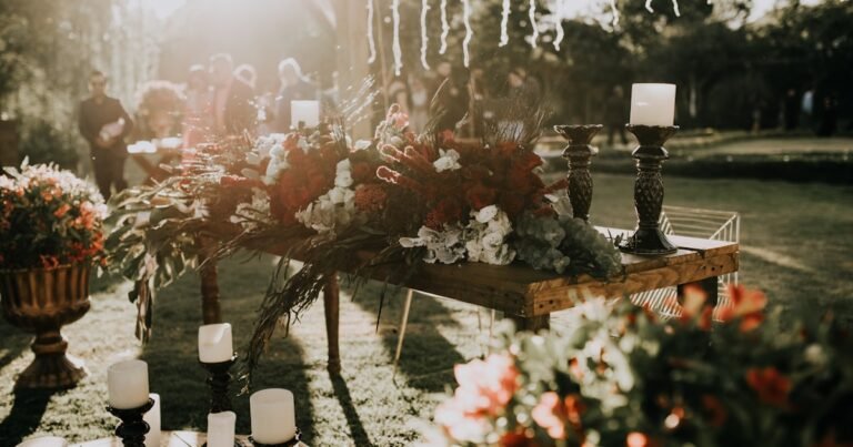 Wedding decor checklist essentials with floral centerpieces and candle holders on a reception table