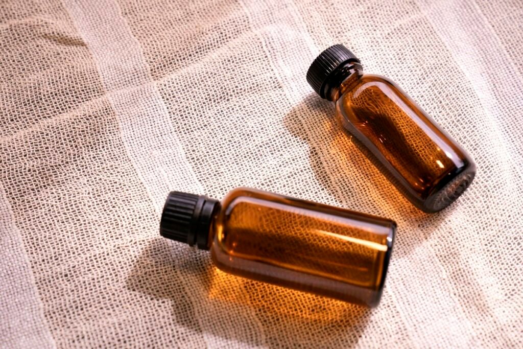 Two small amber glass bottles on a table