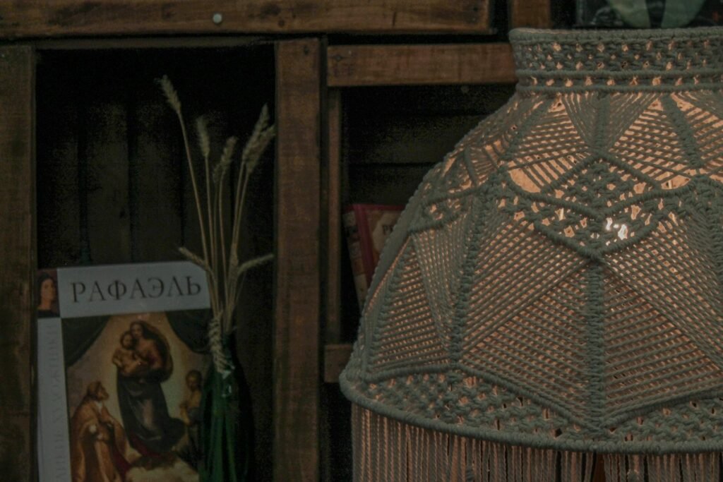 Book and dried wheat stalks on a shelf