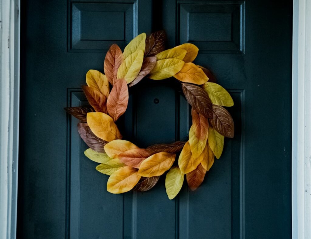 Yellow leaves on a blue wooden door
