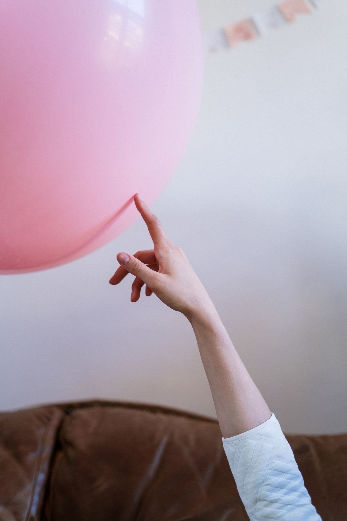 Pink balloon in an indoor party setting