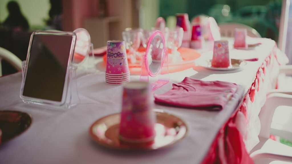 Party table set up with pink decorations