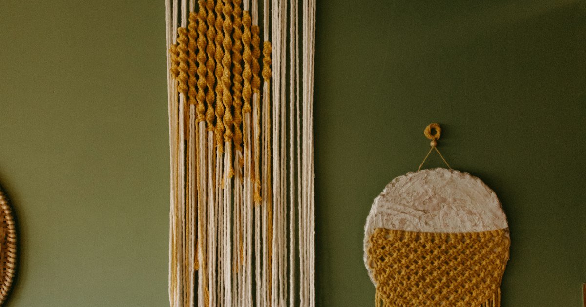 Macrame wall hangings in earthy boho tones for classroom feature wall