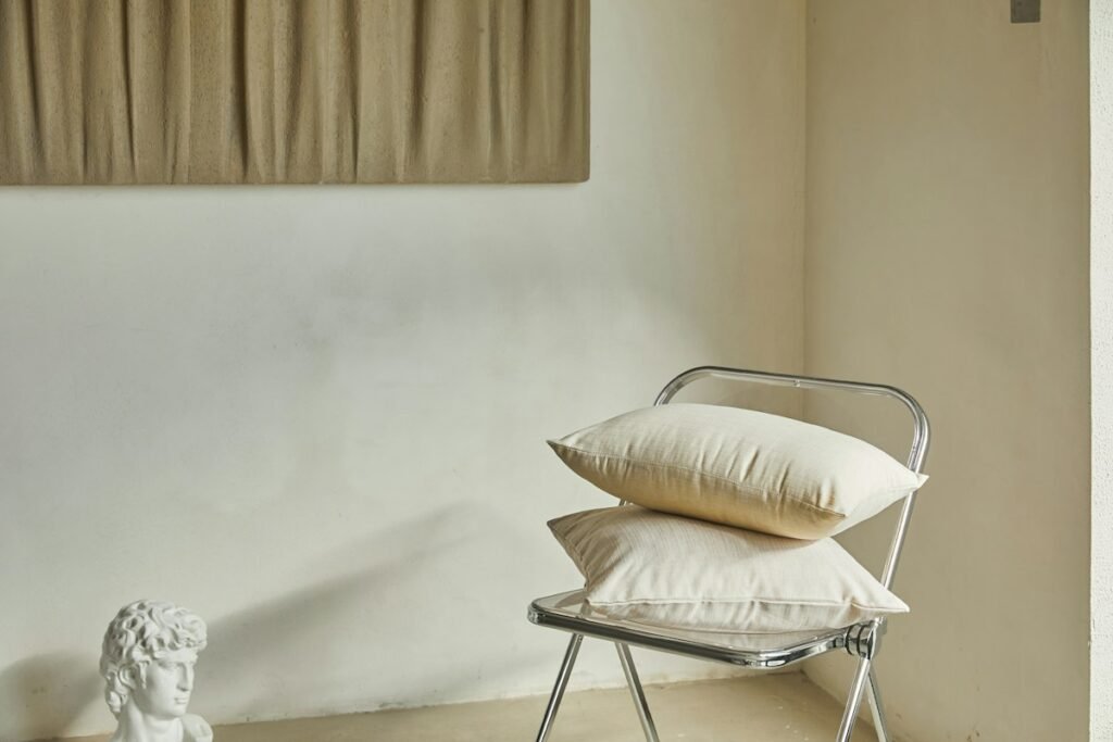 White and brown throw pillow on a white couch