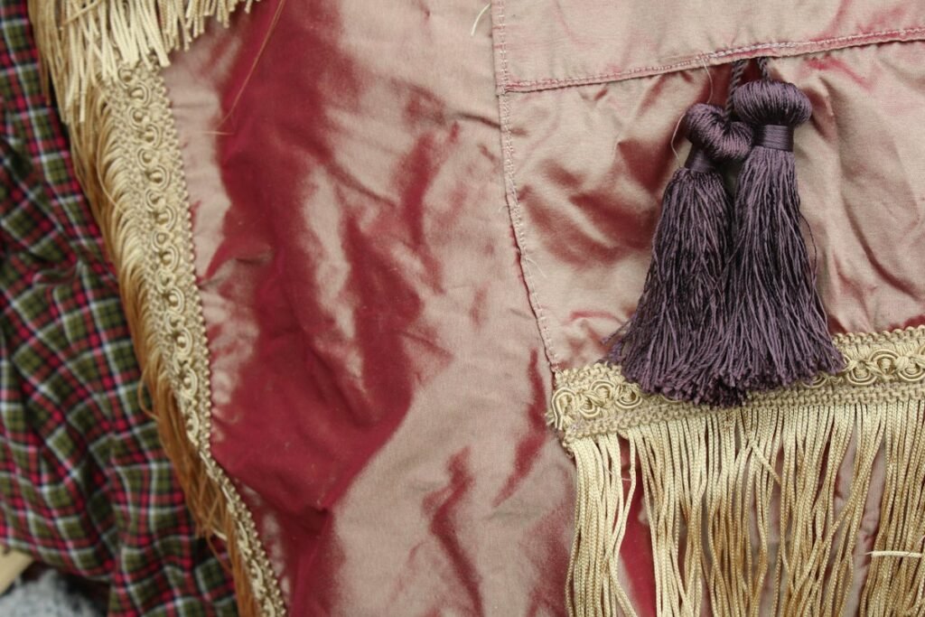 Close-up of cloth edged with tassels