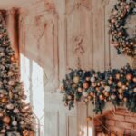 Living room with fireplace showing christmas tree decorating ideas in warm neutral tones