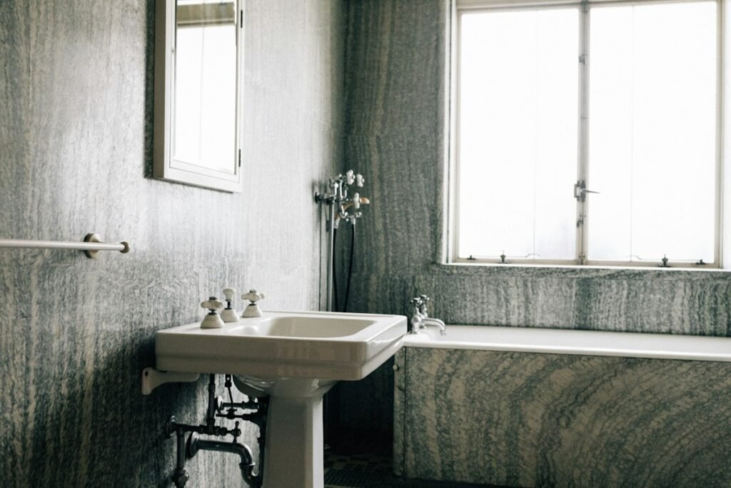 Vintage bathroom with a pedestal sink and a bathtub