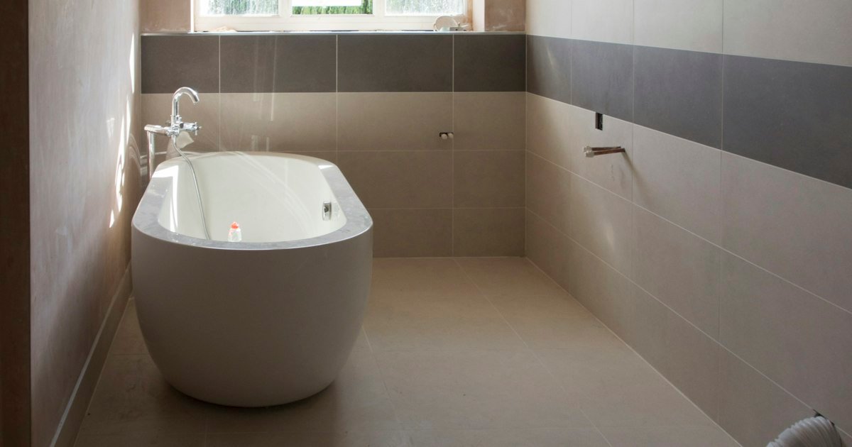 Shared bathroom layout with a tub and sink