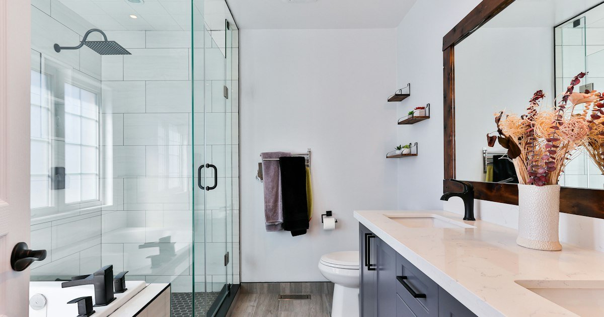 Modern glass shower beside a vanity