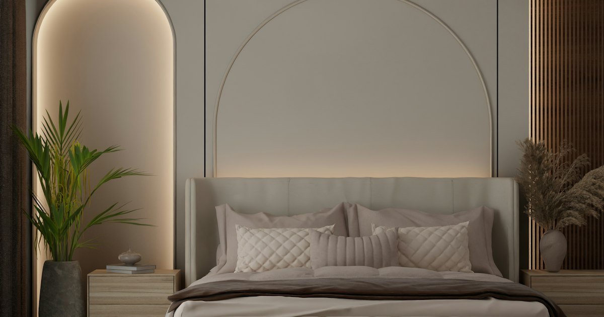 Japandi rug in a modern bedroom with an arched headboard and neutral decor