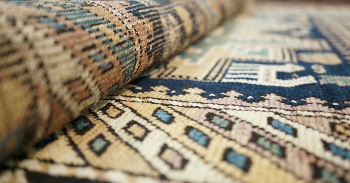 Close-up texture of a natural fiber rug in a subtle japandi pattern