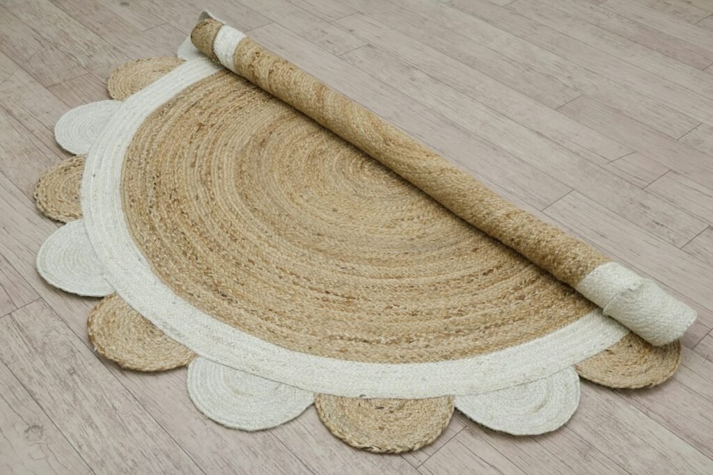 Half-rolled circular rug on a wooden floor