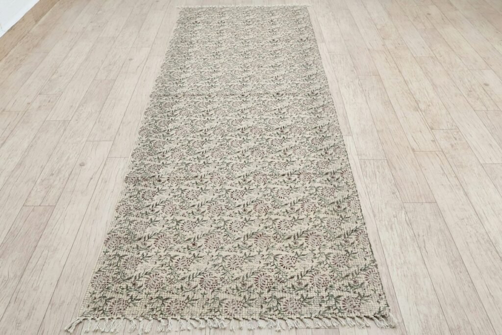 Patterned runner rug on a wooden floor