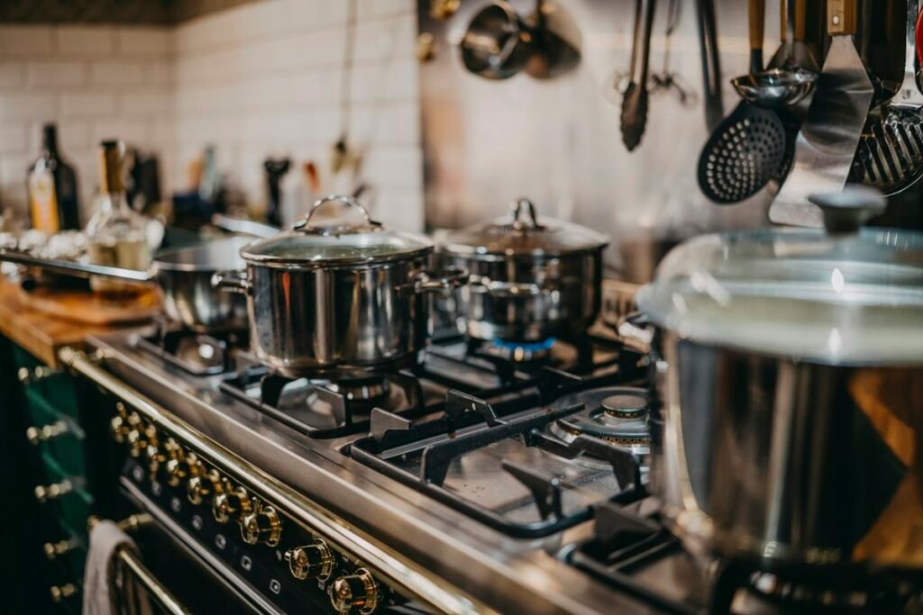 Stainless steel pots on a gas stove