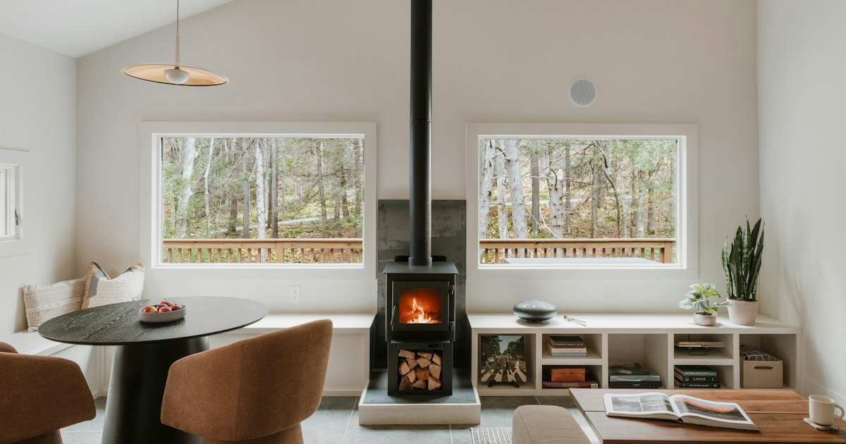 Fireplace seating framed by large windows
