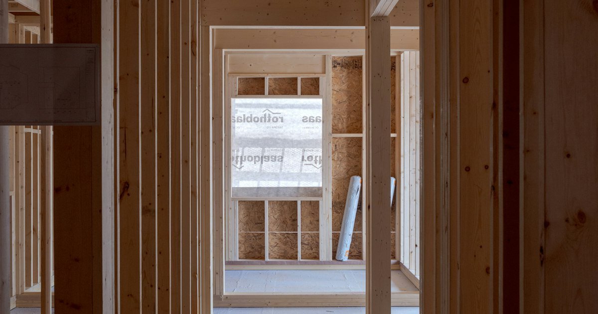 Wood-paneled walls under exposed ceiling beams
