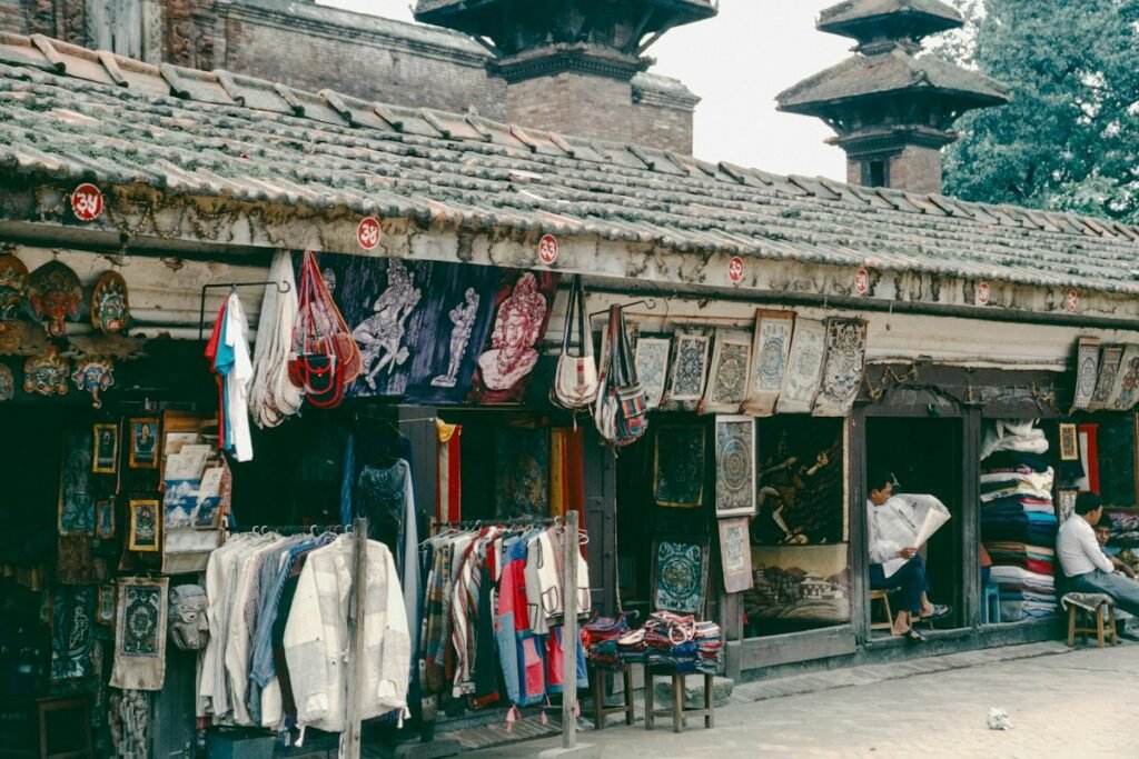 Outdoor market stall with hanging textiles