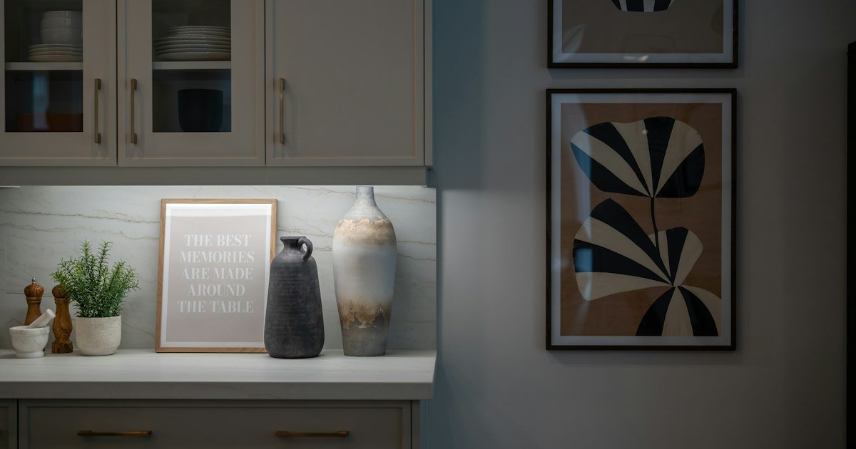 Warm neutral vases and framed art