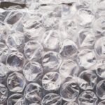 Bubble wrap home decor starts here: a close-up of clear polyethylene bubble wrap catching the light