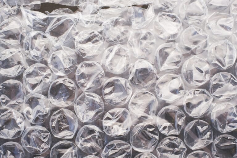 Bubble wrap home decor starts here: a close-up of clear polyethylene bubble wrap catching the light
