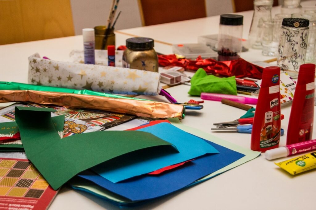 Craft supplies spread across a table, ready for dollar tree diy christmas decorations