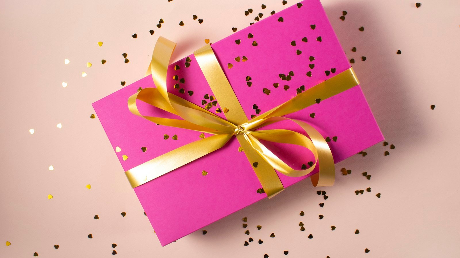 Blush wrapped gift as part of a pink Christmas decor scheme