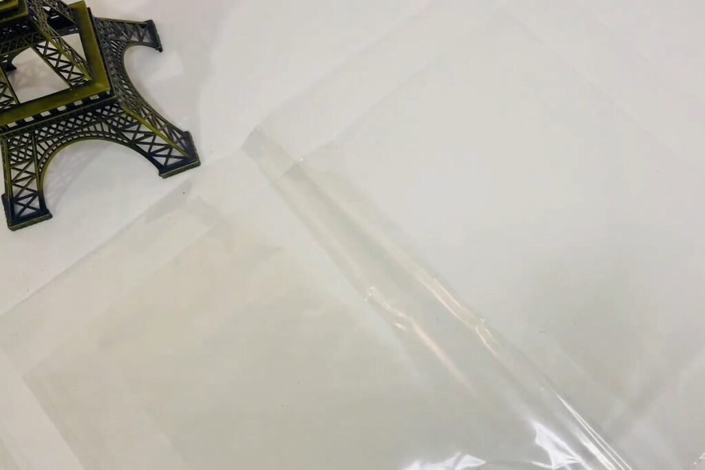 A clear plastic sheet smoothed out flat on a white table