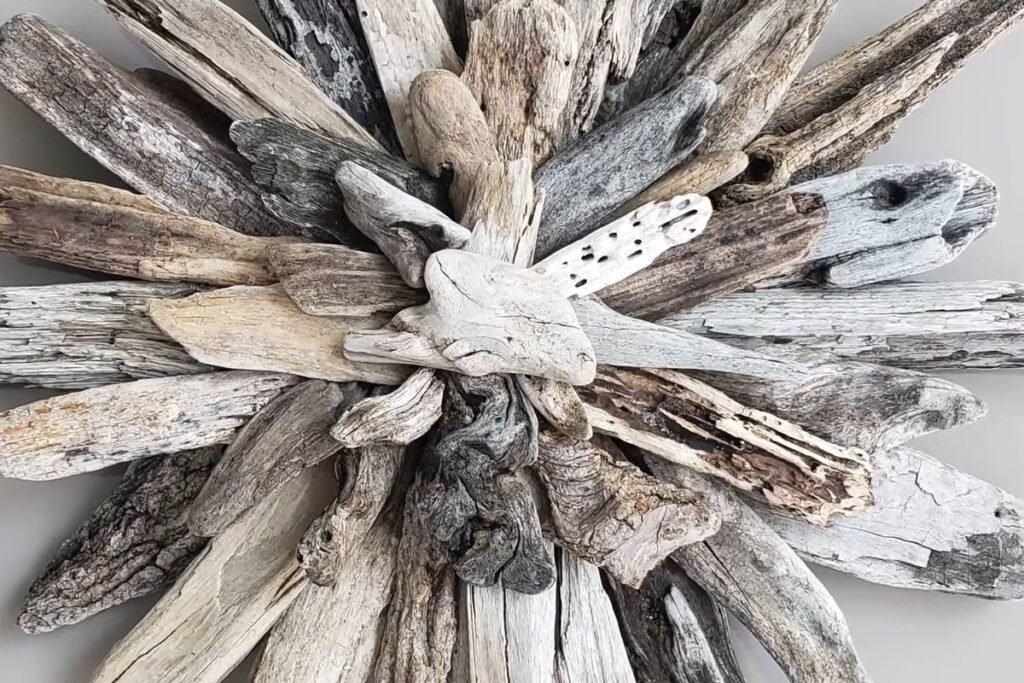 Close view of a pale driftwood starburst with a carved driftwood centre