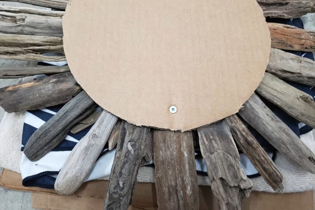 Back of the starburst showing the cardboard circle and a screw head